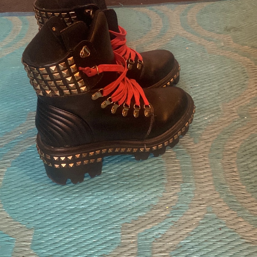 Studded black boots with red lace